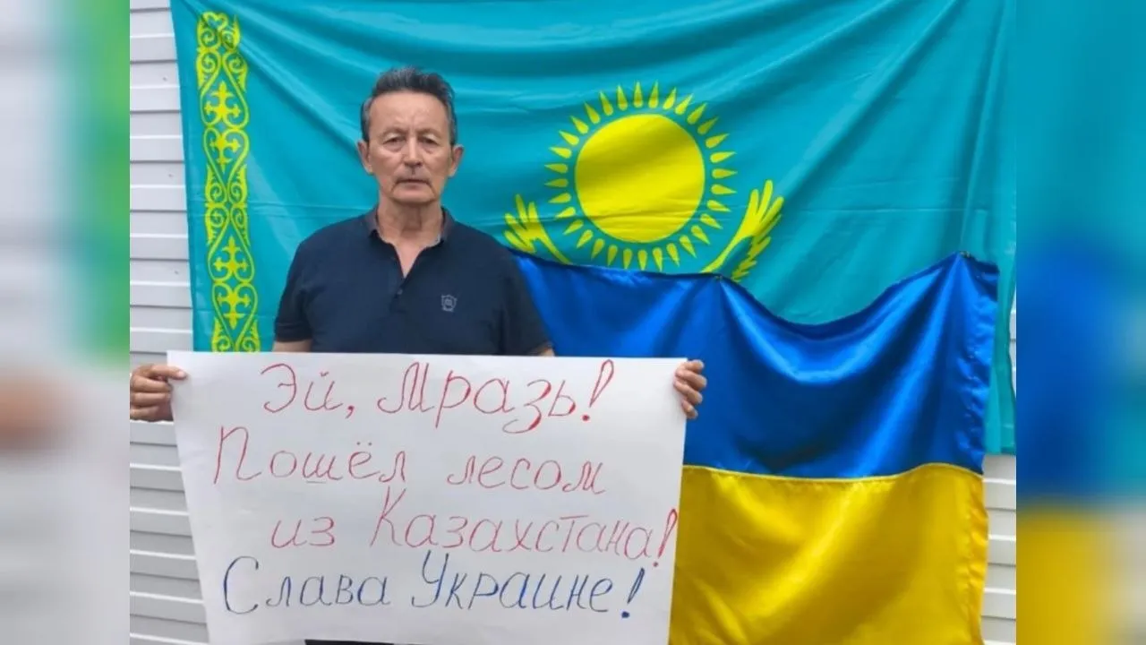 An activist holding an anti-Putin sign was detained in Kazakhstan during Putin's visit