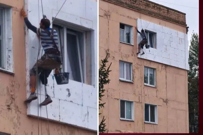 Мужчина с протезом утепляет фасад пятиэтажного дома в Василькове