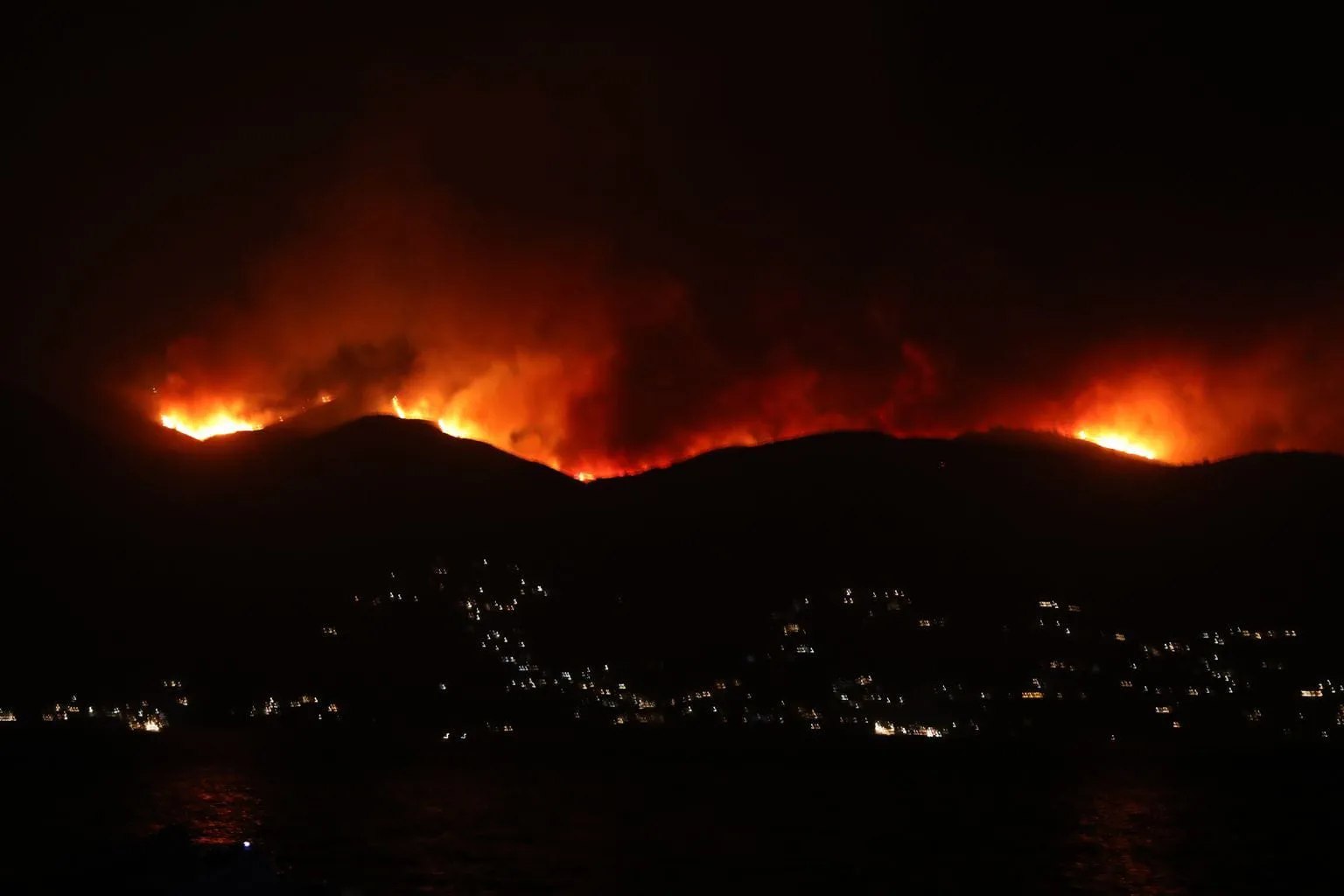 Tourists are being evacuated in Greece due to widespread wildfires