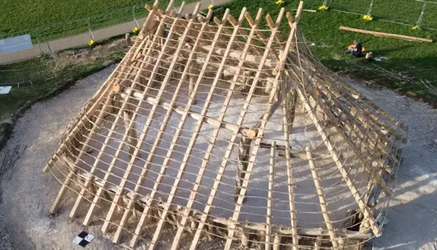 In Britain, a 4,500-year-old hall near Stonehenge is being reconstructed