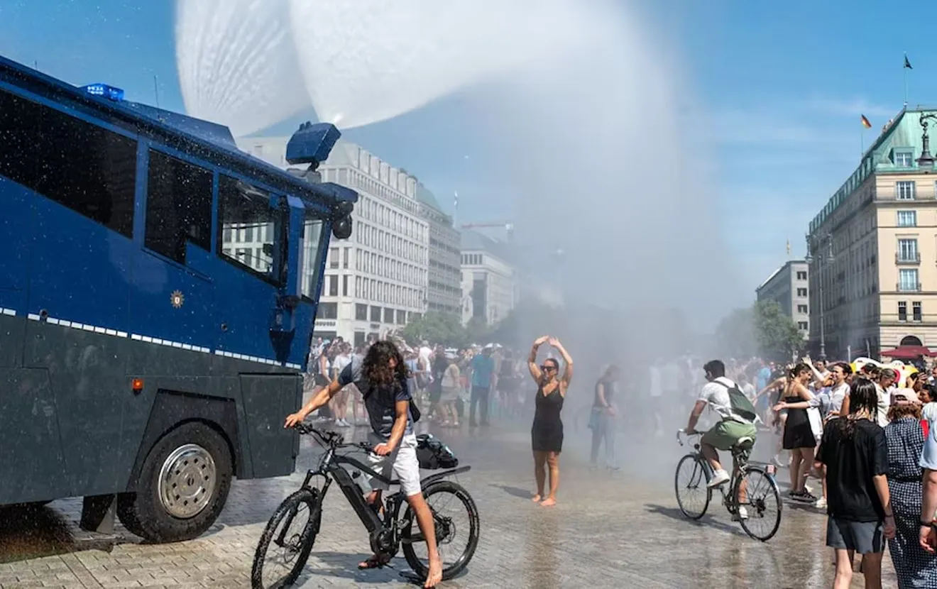 VIDEO: Police in Germany used water cannons to cool people down during a record-breaking heat wave
