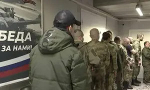 Russians are being detained for taking photos of soldiers' graves and accused of treason
