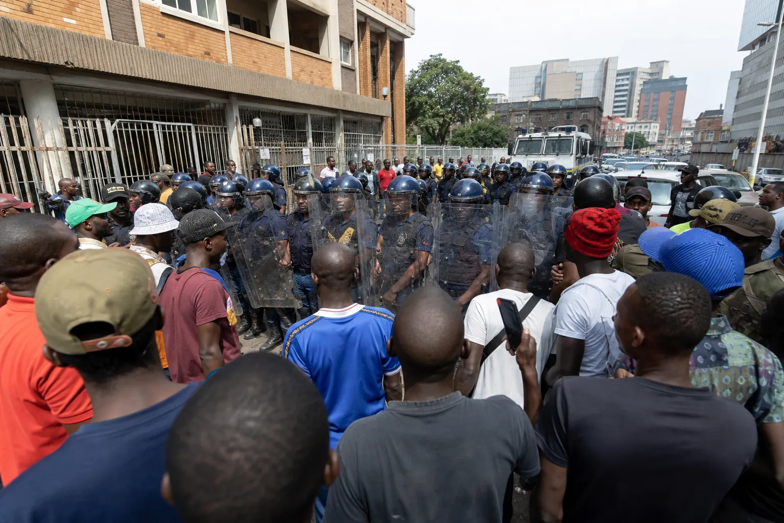 In Durban, police escort Mayor Cyril Xaba away from anti-migrant protest