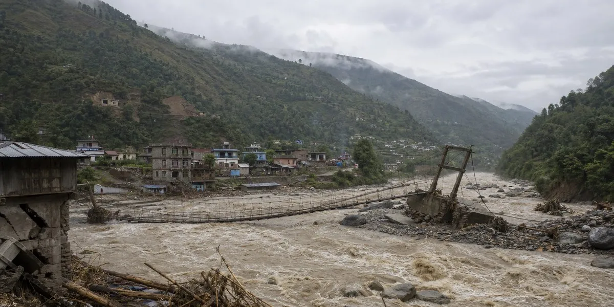 Flood in Nepal washes away about 12 houses and several bridges — BBC News