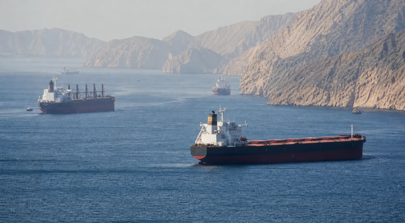 Iran says it will respond to new US attacks, traffic through Strait of Hormuz declines