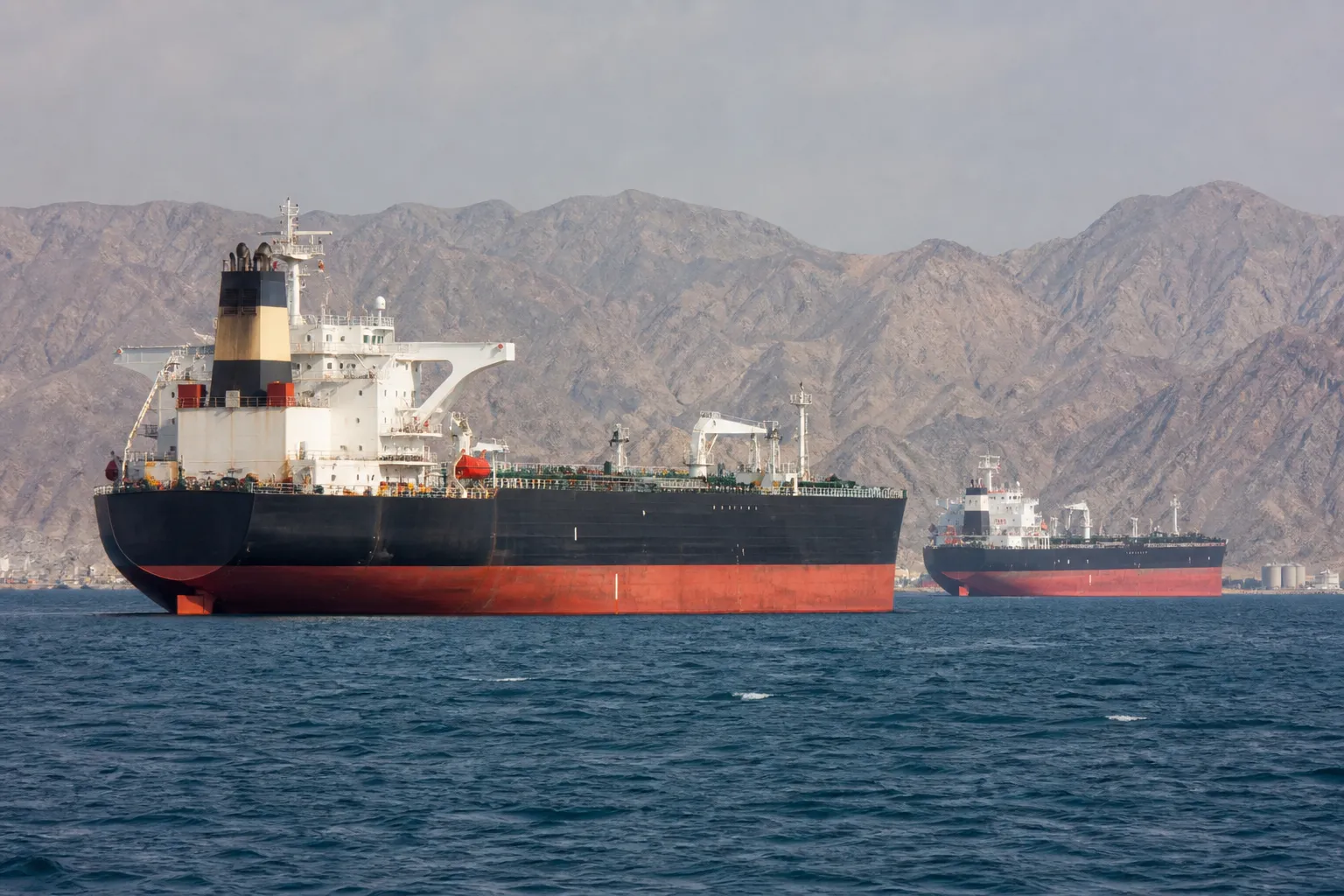 Covert shipments through the Strait of Hormuz are helping to keep oil prices in check